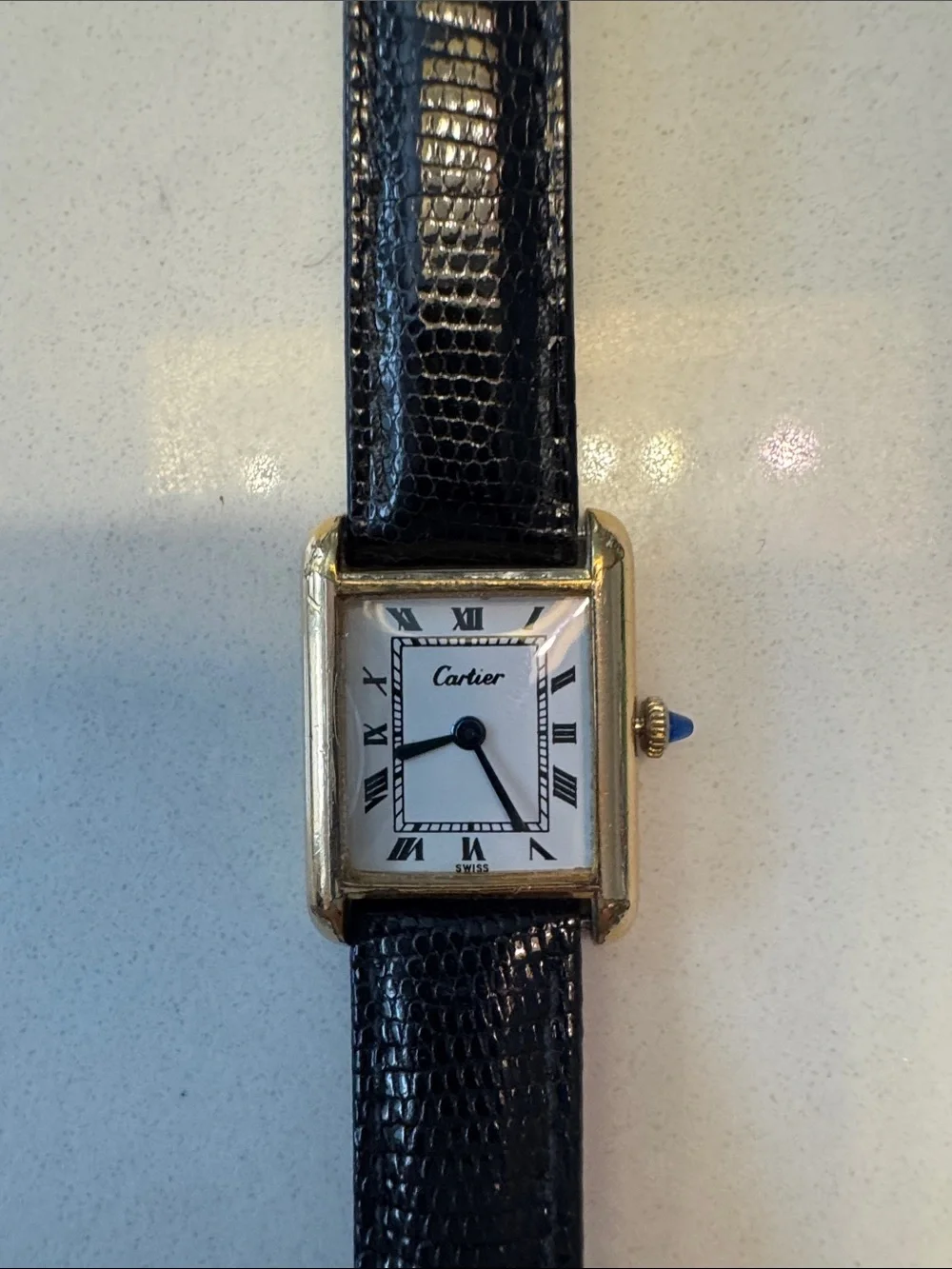 Cartier Gold Tone Rectangular Watch with dark brown Strap and sapphire Cabochon